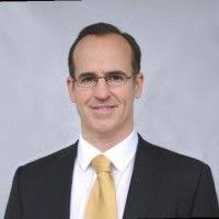Formal portrait of Brian Westley in a suit and tie